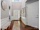 Inviting foyer featuring gleaming hardwood floors, a high ceiling, and stylish decor at 43041 Mimosa Ct, Fort Mill, SC 29707