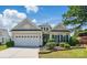 Charming single-story home with a two-car garage, manicured lawn, and beautiful landscaping at 43041 Mimosa Ct, Fort Mill, SC 29707