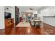 Cozy living room featuring a fireplace, hardwood floors, and elegant furnishings at 43041 Mimosa Ct, Fort Mill, SC 29707