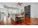 Bright living room with a fireplace, modern ceiling fan, and stylish decor at 43041 Mimosa Ct, Fort Mill, SC 29707
