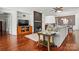 Open-concept living room with a fireplace, built-ins, and comfortable seating at 43041 Mimosa Ct, Fort Mill, SC 29707