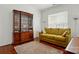 Comfortable living room showcasing hardwood floors, a stylish cabinet, and a cozy sofa for relaxation at 43041 Mimosa Ct, Fort Mill, SC 29707