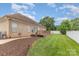 Exterior shot features a spacious backyard with a patio and lush green lawn at 4406 Atkinson Way, Monroe, NC 28110