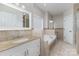 Bright bathroom features a separate tub and shower, tile accents, and granite countertops at 4406 Atkinson Way, Monroe, NC 28110