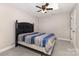 This bedroom has a ceiling fan, a large closet, and carpet flooring at 4406 Atkinson Way, Monroe, NC 28110