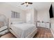 Cozy bedroom with a ceiling fan, a large bed, and minimalist decor at 4406 Atkinson Way, Monroe, NC 28110