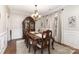 Formal dining room with hardwood floors, wooden table, and elegant decor at 4406 Atkinson Way, Monroe, NC 28110