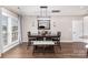 Bright dining area with modern lighting and dark wood table at 4406 Atkinson Way, Monroe, NC 28110