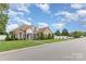 Attractive single-Gathering house with mature landscaping, featuring lush lawn and a charming front entrance at 4406 Atkinson Way, Monroe, NC 28110
