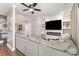 Living room featuring a large couch, fireplace with TV, and hardwood floors at 4406 Atkinson Way, Monroe, NC 28110