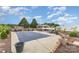 Backyard features a covered, outdoor bar, in-ground pool with patio, and landscaped area at 4406 Atkinson Way, Monroe, NC 28110