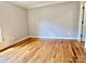 Bright bedroom with hardwood flooring, neutral walls, and natural light from the window at 456 Brook Valley Ne Ct, Concord, NC 28025