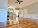 Open-concept view into the living room and kitchen featuring hardwood floors, fireplace, and lots of natural light at 456 Brook Valley Ne Ct, Concord, NC 28025