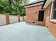 Outdoor patio area with modern concrete and brick exterior, ideal for entertaining at 456 Brook Valley Ne Ct, Concord, NC 28025