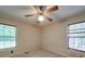 Comfortable bedroom with two windows, inviting ample natural light, and carpeted floor at 4620 Binwhe Ln, Gastonia, NC 28052