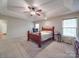 Bedroom boasts natural light and tray ceiling with stylish fan, creating a relaxing atmosphere at 4620 Binwhe Ln, Gastonia, NC 28052