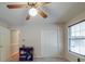 This carpeted bedroom features a double door closet and a window for natural light at 4620 Binwhe Ln, Gastonia, NC 28052