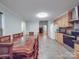 Bright kitchen featuring wood cabinets, stainless steel appliances, and a large dining table at 4620 Binwhe Ln, Gastonia, NC 28052