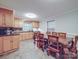 Kitchen showcasing wood cabinets, stainless appliances, and a large wooden table perfect for Gathering meals at 4620 Binwhe Ln, Gastonia, NC 28052