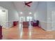 Spacious living room boasting hardwood floors, vaulted ceilings, and ample natural light, perfect for entertaining at 4620 Binwhe Ln, Gastonia, NC 28052