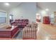 Inviting living room with vaulted ceilings, stone fireplace, and views to the breakfast nook at 4620 Binwhe Ln, Gastonia, NC 28052