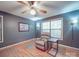 Inviting room with a comfortable recliner, hardwood floors, and natural light from the window at 4620 Binwhe Ln, Gastonia, NC 28052