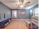 Cozy living room with hardwood floors, a ceiling fan, and a comfortable recliner at 4620 Binwhe Ln, Gastonia, NC 28052
