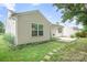 Spacious backyard features a grassy lawn and paved patio, ideal for entertaining at 4719 Sahalee Ln, Charlotte, NC 28216