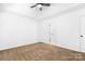 Bedroom with neutral carpet, ceiling fan, window, and vaulted ceiling at 4719 Sahalee Ln, Charlotte, NC 28216