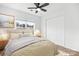 Comfortable bedroom featuring a ceiling fan, window and carpet at 4719 Sahalee Ln, Charlotte, NC 28216