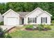 Well-maintained home with black shutters and a manicured front yard landscaping at 4719 Sahalee Ln, Charlotte, NC 28216