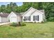 Beautiful, well maintained lawn surrounding home with manicured landscaping and flowerbeds at 4719 Sahalee Ln, Charlotte, NC 28216