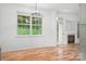 Bright living room with a large window, hardwood floors, and cozy fireplace at 4719 Sahalee Ln, Charlotte, NC 28216