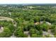 An aerial view showcases the neighborhood with lush greenery and the property location at 4846 Deer Cross Trl, Charlotte, NC 28269