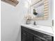 Elegant bathroom with a vanity, a decorative mirror, and white floral arrangement at 4846 Deer Cross Trl, Charlotte, NC 28269