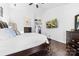 Cozy bedroom with neutral décor, a ceiling fan, and a flat screen TV mounted on the wall at 4846 Deer Cross Trl, Charlotte, NC 28269