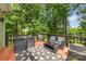 Charming deck with outdoor seating nestled amongst lush greenery, perfect for entertaining at 4846 Deer Cross Trl, Charlotte, NC 28269