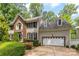 Charming two-story home featuring a brick accent wall, attached two car garage and beautifully manicured landscaping at 4846 Deer Cross Trl, Charlotte, NC 28269