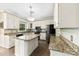 Spacious kitchen featuring white cabinets, stainless appliances, granite countertops, and a large island at 4846 Deer Cross Trl, Charlotte, NC 28269