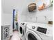Convenient laundry room with modern appliances, a window, and ample shelving at 4846 Deer Cross Trl, Charlotte, NC 28269