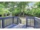 The wood deck overlooks the large, mature, and shady backyard at 4913 Winchester St, Charlotte, NC 28208
