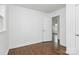 A clean, comfortable bedroom with a view to the hallway through an open door at 4913 Winchester St, Charlotte, NC 28208