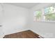 Updated bedroom with freshly painted walls and beautifully refinished hardwood floors at 4913 Winchester St, Charlotte, NC 28208