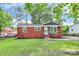 Lovely brick home featuring a well-kept lawn and classic design, creating a welcoming and timeless curb appeal at 4913 Winchester St, Charlotte, NC 28208