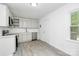 Well-lit kitchen with white cabinets, stainless steel appliances, and a clean, modern design, creating a welcoming and efficient cooking area at 4913 Winchester St, Charlotte, NC 28208