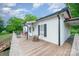 A cozy home features a back deck complete with a porch swing and chairs for relaxing outdoors at 511 W Finger St, Maiden, NC 28650
