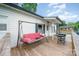 Relaxing back porch area includes a porch swing, grill, and wooden decking at 511 W Finger St, Maiden, NC 28650