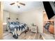 Bedroom with hardwood floors, a ceiling fan, and a wooden headboard that adds rustic charm to the home at 511 W Finger St, Maiden, NC 28650