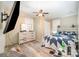 Bedroom with hardwood floors, a ceiling fan, a tv, and a wooden headboard that adds rustic charm to the home at 511 W Finger St, Maiden, NC 28650