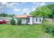 View of the exterior of a single-story home with a red metal roof at 511 W Finger St, Maiden, NC 28650